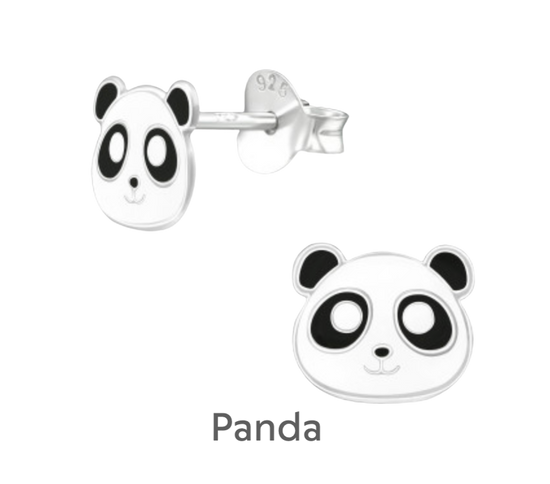 a pair of panda bear earrings on a black background