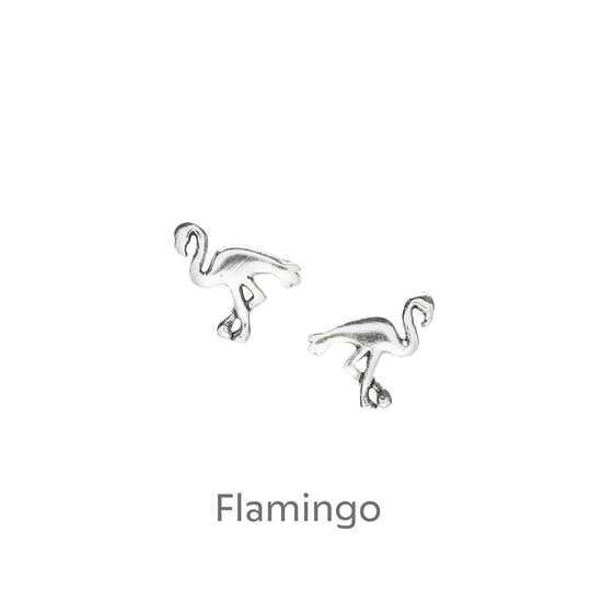 a pair of silver flamingos on a black background