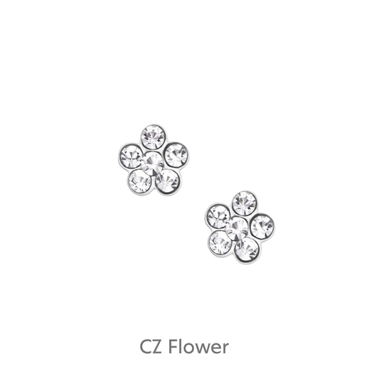 a pair of diamond earrings on a black background