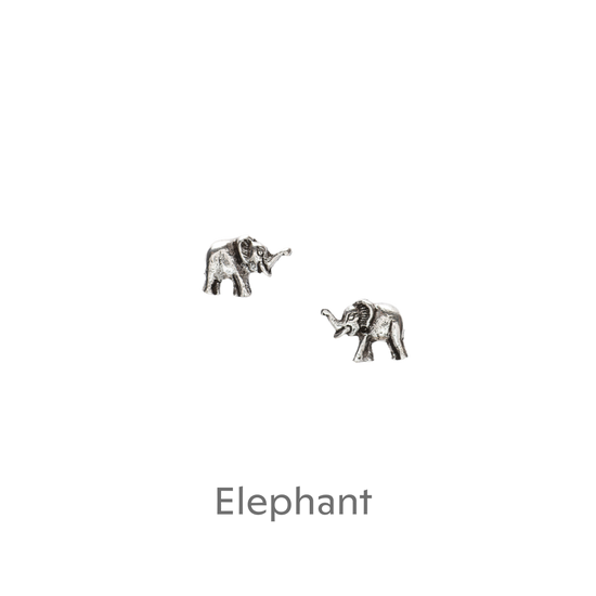 a pair of silver elephants on a black background