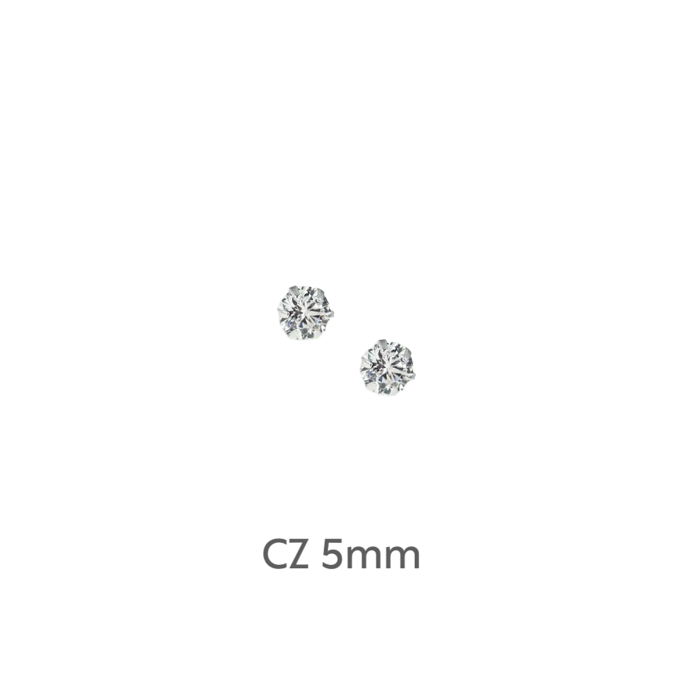 a pair of diamond earrings on a black background