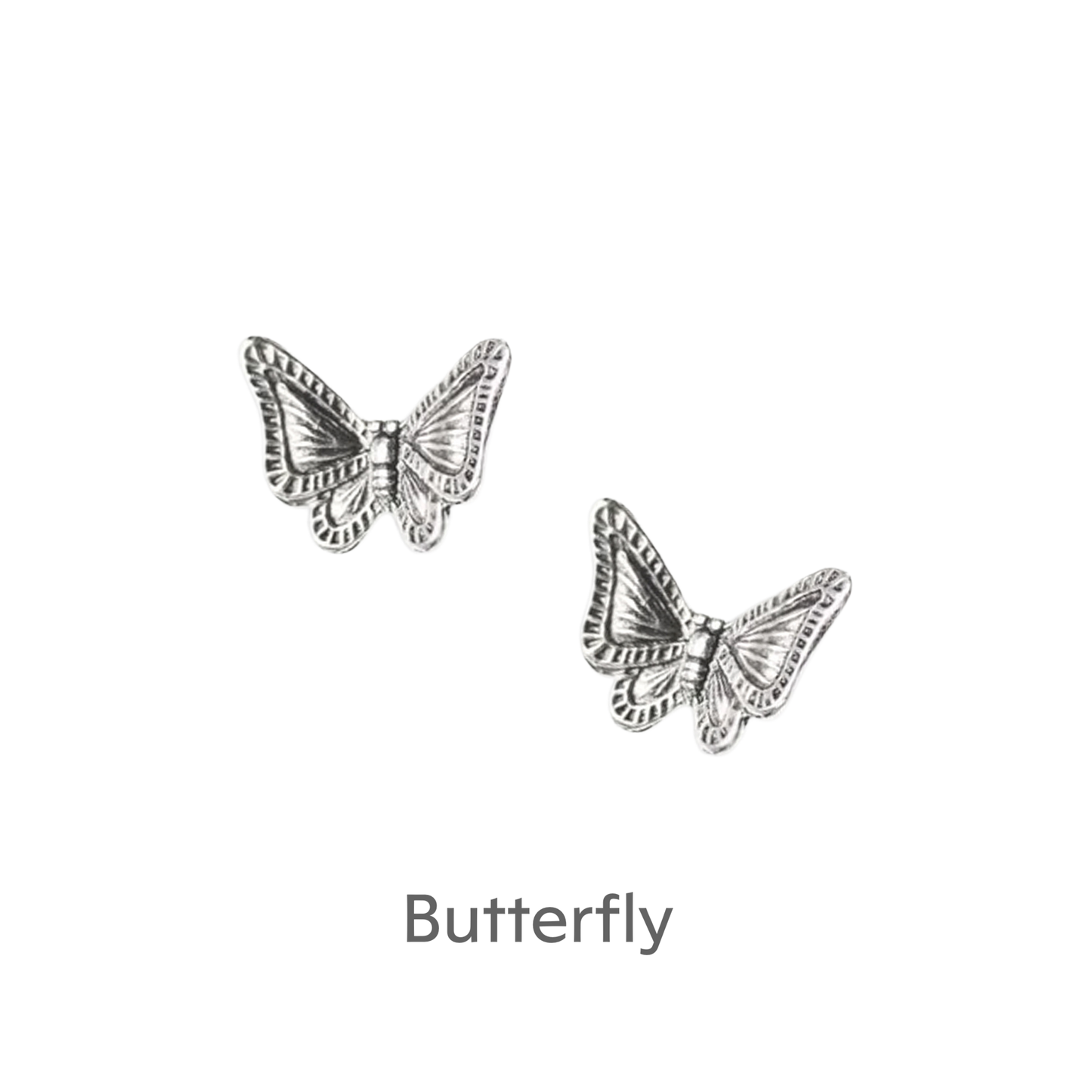 a pair of silver butterflies on a black background