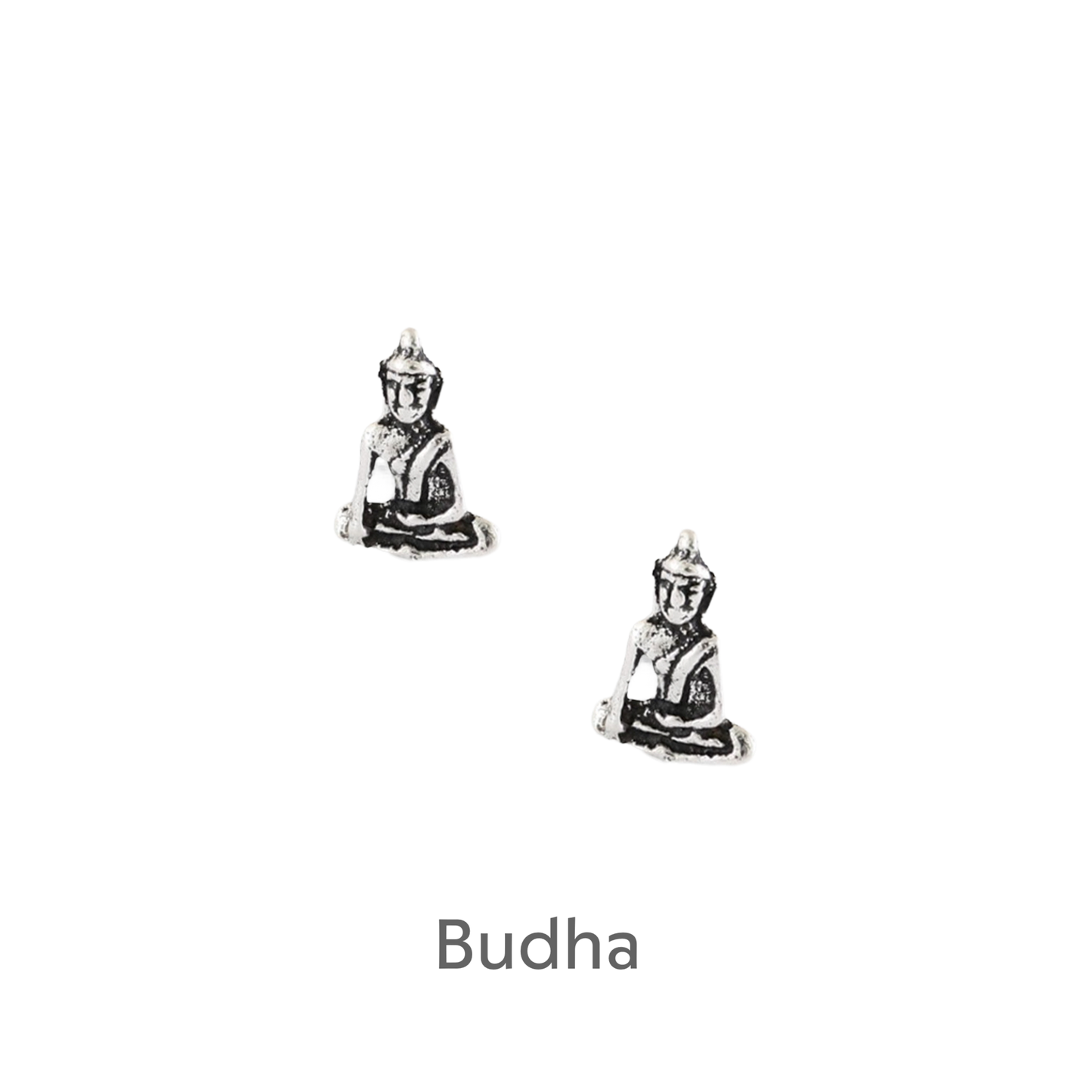 a pair of silver buddha earrings on a black background