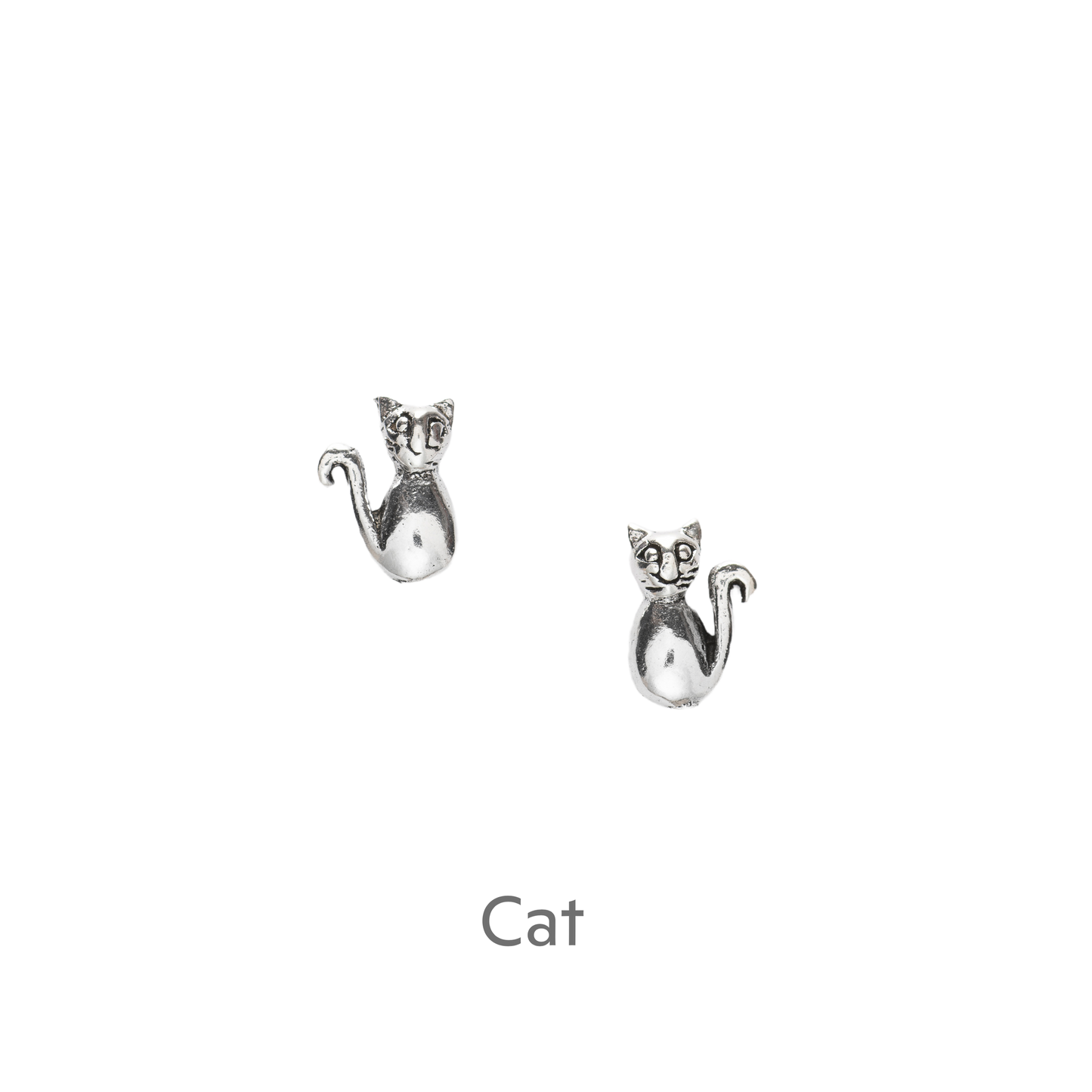 a pair of silver cat earrings on a black background