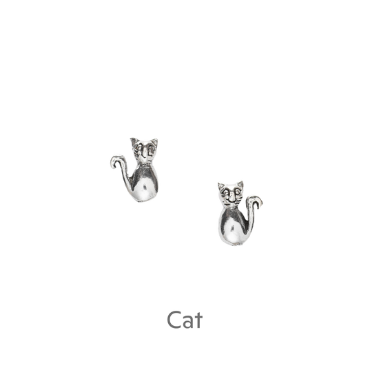 a pair of silver cat earrings on a black background