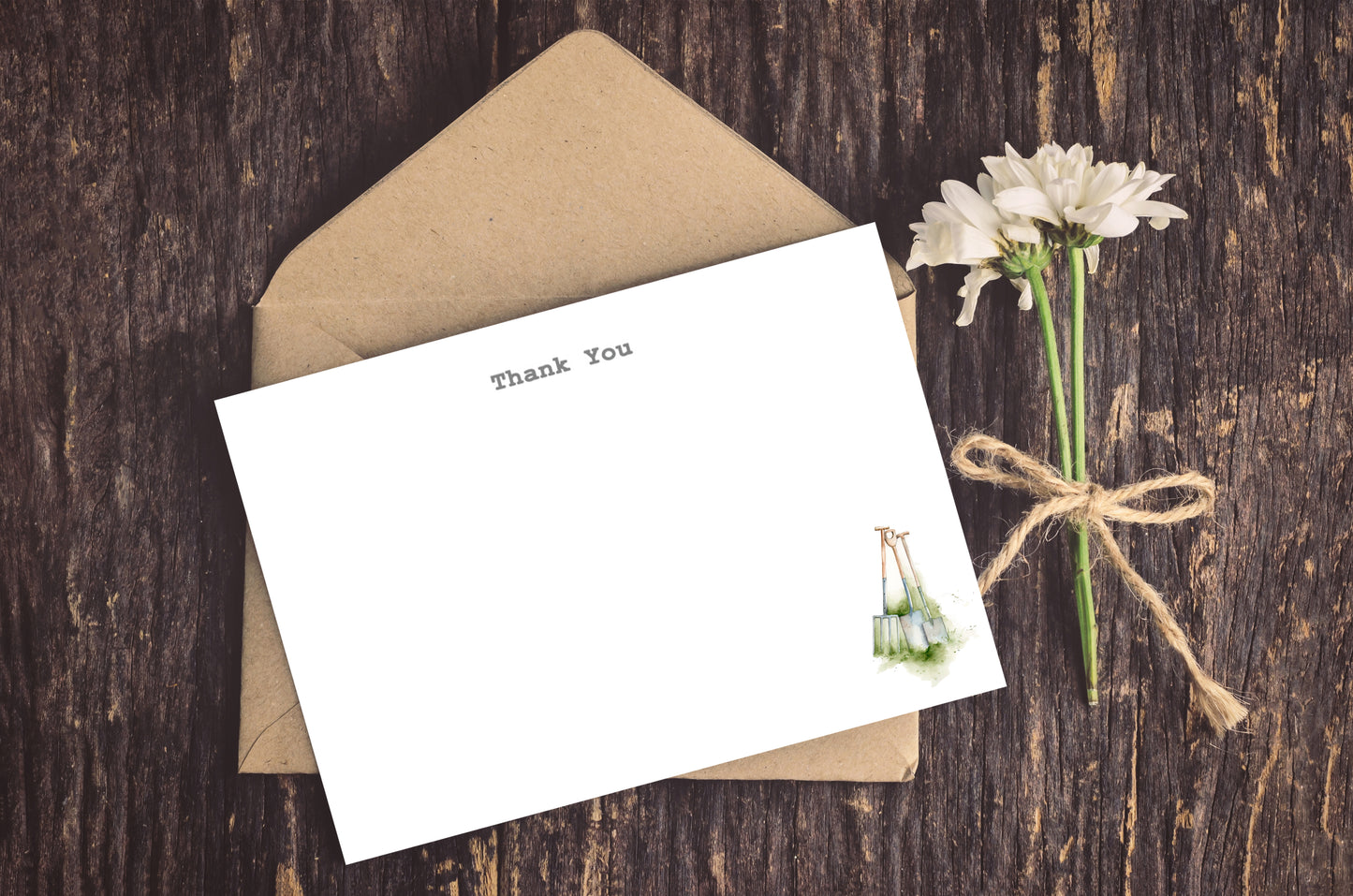 a card with a pair of earrings on it next to a flower